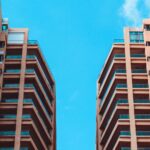 Two High Rise Apartment Buildings and Blue Sky