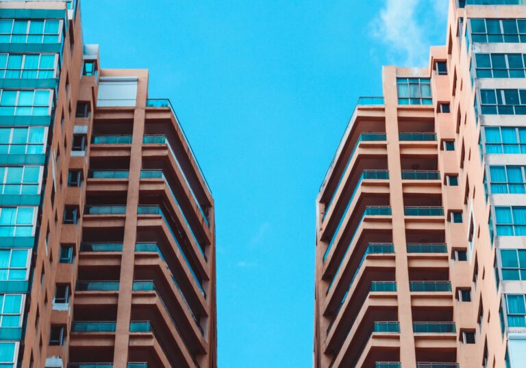 Two High Rise Apartment Buildings and Blue Sky